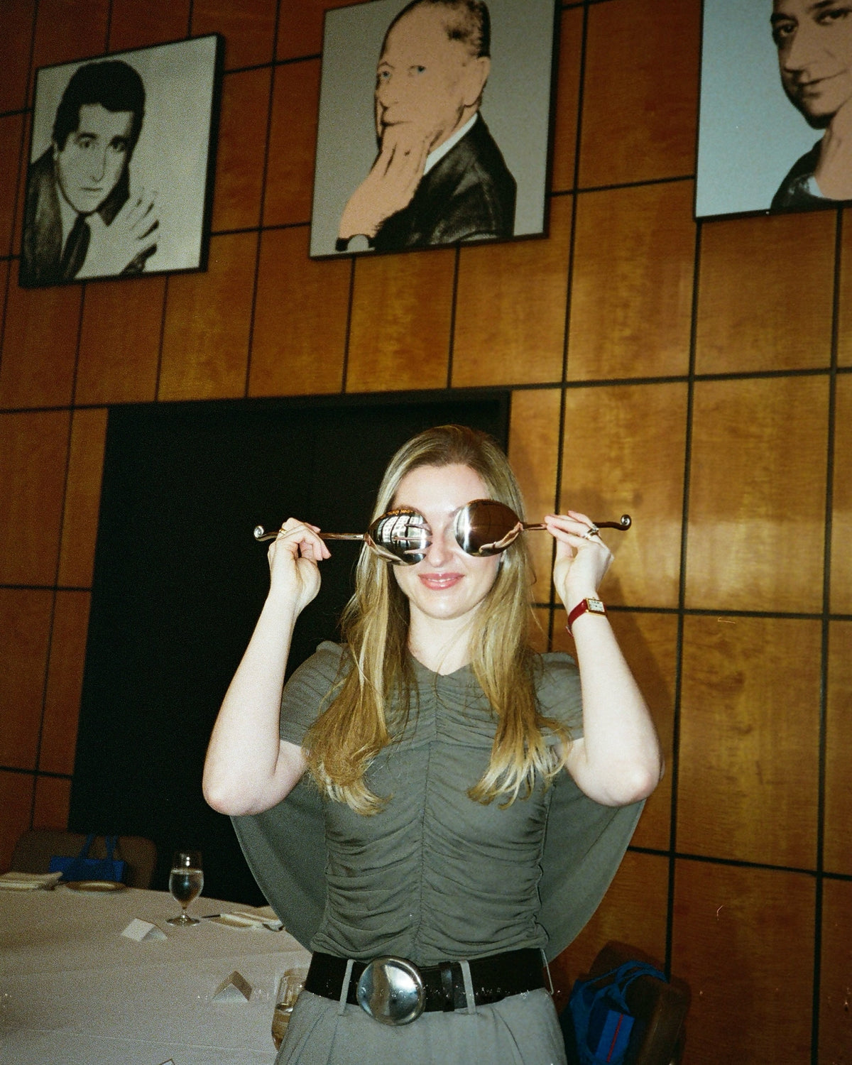 jamie holding two spiral serving spoons over her eyes