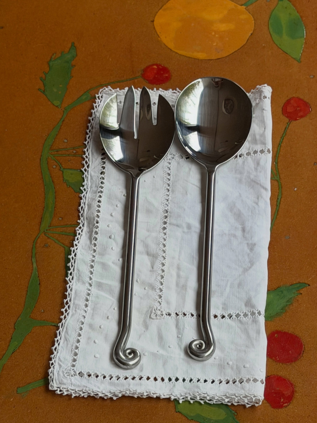 the ladies who lunch serving set on a linen napkin, on a painted table