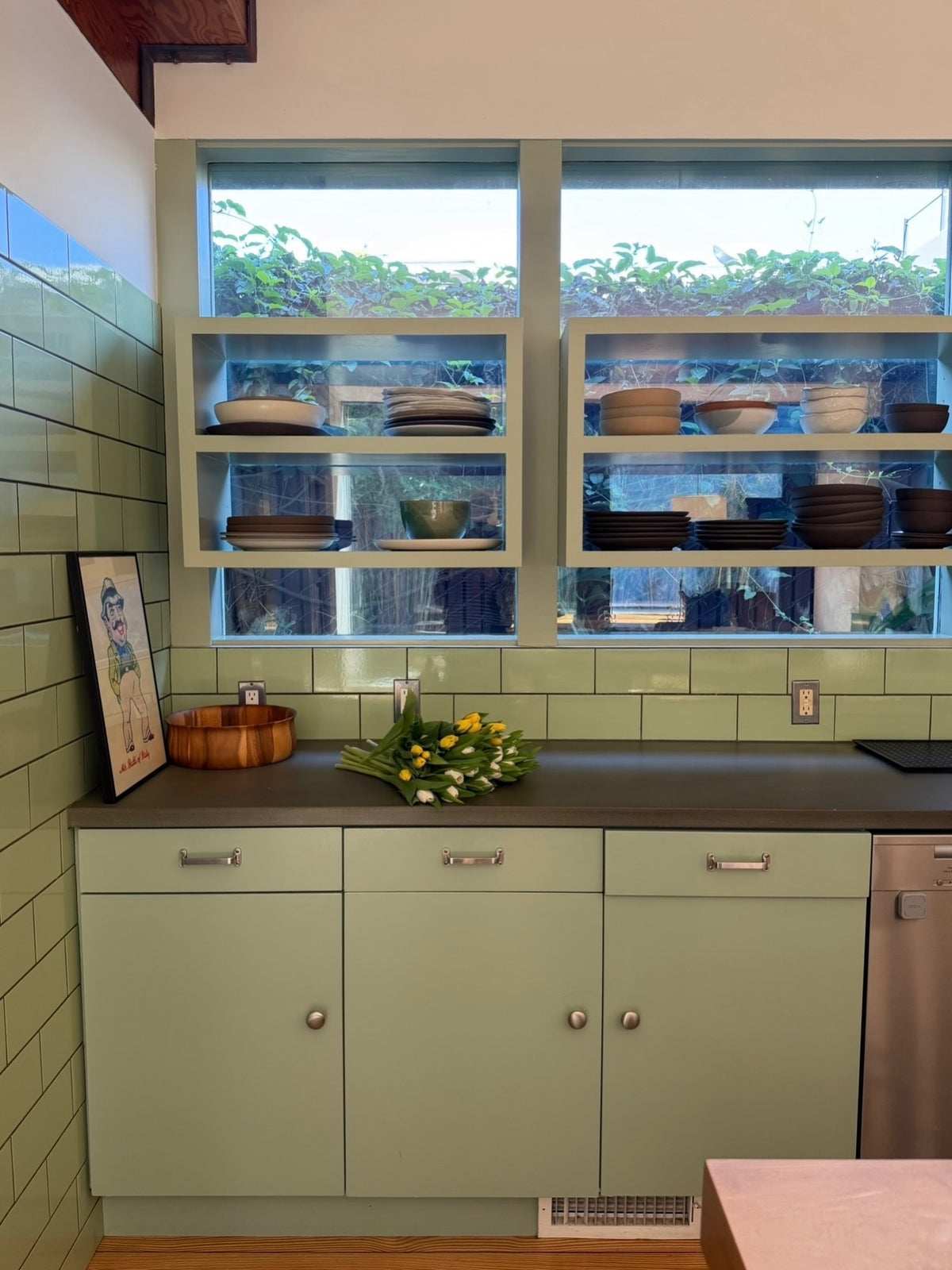 jamie's green kitchen with the exposed staircase